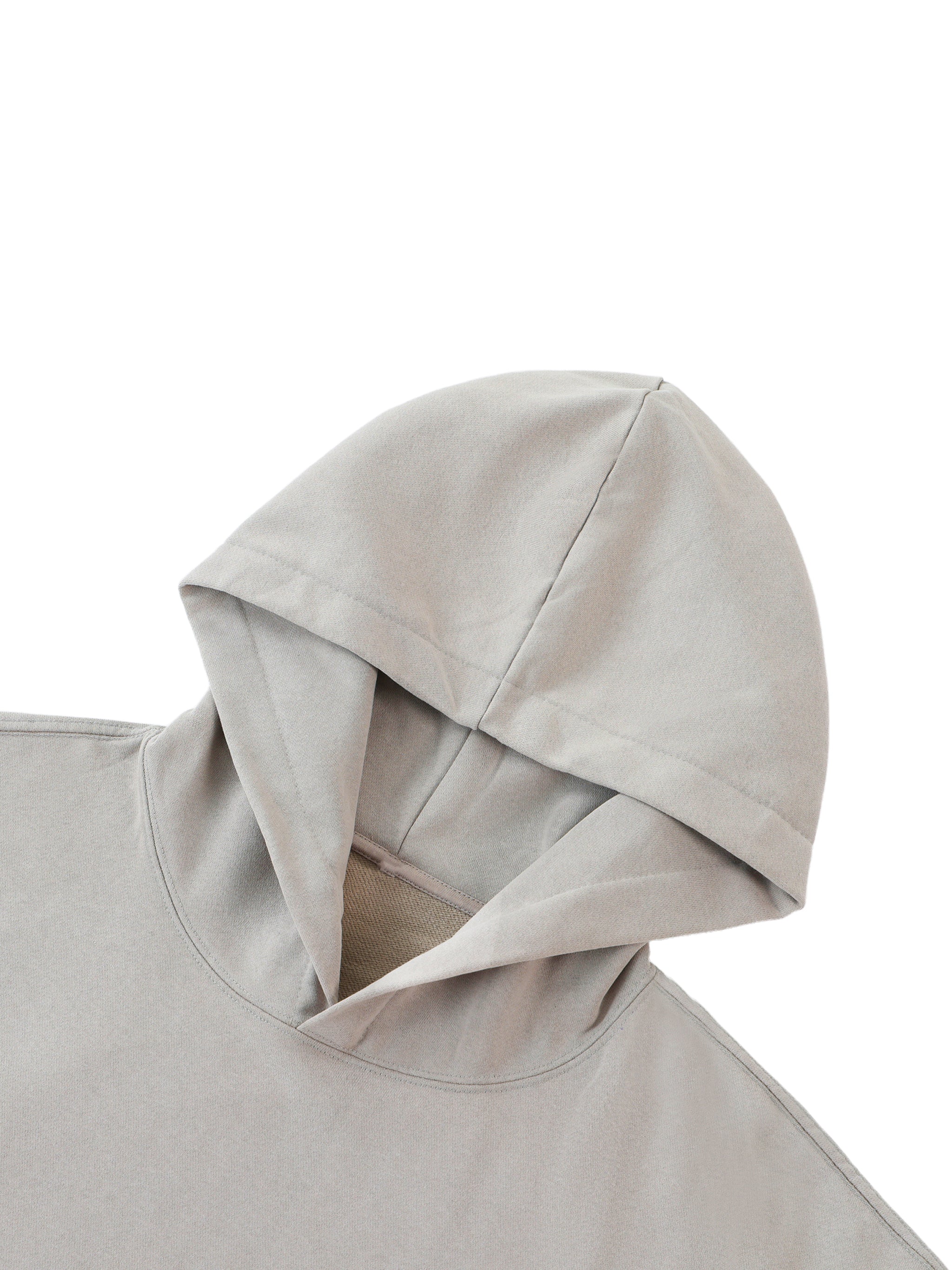 Close-up of a beige hooded garment on a white background